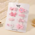 Detail view of 8-piece pink baby hair clip set with butterfly and bow on display card - 8 Pcs Pack / Pink Set (8C)