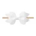 Suave lazo de tela blanca en una diadema elástica de nailon color nude para niñas - Lazo de 8.5cm / Blanco