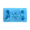 Soft nylon baby headband featuring a large light blue grosgrain ribbon bow for infants. - Lake Blue