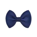 Macro view of a navy blue grosgrain ribbon bow hair clip for children and toddlers - Navy Blue