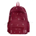 Front view of burgundy student backpack with white lightning pattern and large pocket - Red