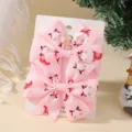 Set of two pink Christmas hair bows featuring Santa and snowflake patterns for kids - 2A-7 (Pink Santa Claus)
