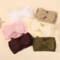 Collection of six soft baby headbands with large textured lace bows in various colors. - Classic Six Colors