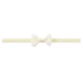 Cream baby headband made of soft elastic nylon featuring a delicate ribbed bow - Off White