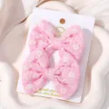 Pair of pink embroidered fabric bow hair clips for kids on a decorative white card - Floral Embroidered Bow (25)
