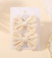 Pair of cute pale yellow floral embroidered fabric bow hair clips on display card - Floral Embroidered Bow (29)