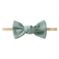 Handmade soft mint green linen-textured bow headband with elastic tan band for baby girls - Bean Green