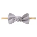 Soft baby bow headband in solid lavender with high-elastic nude strap for toddlers - Lavender