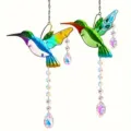 Detail view of two colorful hummingbird suncatchers with hanging crystal prisms. - Hummingbird Wind Chime Pendant / 2 Pieces