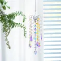 Decorative crystal suncatcher prism hanging ornament reflecting rainbow light in window - K9