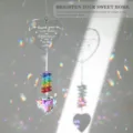 Heart-shaped crystal suncatcher with rainbow beads creating colorful reflections - Thank You