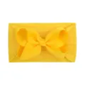 Ultra-soft bright yellow nylon baby headband featuring a large grosgrain ribbon bow - Bright yellow