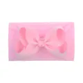 Soft baby pink nylon headband featuring a large grosgrain ribbon bow for infants - Nude Pink