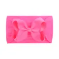 Neon pink soft nylon headband for babies featuring a large decorative grosgrain bow - Rose Pink