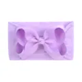 Soft nylon baby headband with a large purple grosgrain ribbon bow - Taro Purple