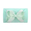 Soft mint green nylon baby headband featuring a large ribbed grosgrain bowknot ornament. - Mint Green