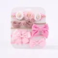 5-delige baby haarbandenset met roze strikken en bloemen op een witte displaykaart. - Stijl 5B / Set van 5 stuks