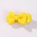 Cute mini yellow grosgrain ribbon bow hair clip for girls featuring a candy color design - Yellow