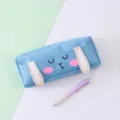 Close up of blue canvas pencil case featuring cute 3D bunny ears and a matching pen. - Sky Blue