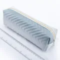 Detailed view of large capacity quilted pencil case with smooth zipper closure for daily use. - Gray