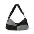 Detail view of washed patchwork denim shoulder bag with contrast orange stitching - Black Patchwork