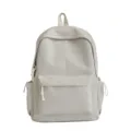 Vue détaillée de face d'un sac à dos beige minimaliste à grande capacité pour l'école - Kaki