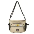 Detail view of khaki workwear messenger bag with decorative badges and mesh pockets - With Badges / Khaki