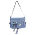 Front view of a blue nylon messenger bag with adjustable strap and multi-pocket design - Messenger Bag (Includes Badges) / Blue