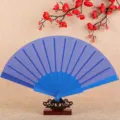 Blue folding fan for women, classic plastic hand fan for dancing and summer cooling use. - Sapphire Blue