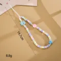 Detail view of handmade pastel beaded phone charm with butterfly and star accents - Striped Bow Flower Style (K6504) / Colorful