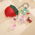 Detail view of cute peach PU leather bag charm with bear and star acrylic charms - Peach Origami Crane Pendant (K1749) / Red