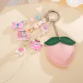 Close-up of cute PU leather peach keychain with colorful acrylic beads and charms - Peach Origami Crane Pendant (K1750) / Pink