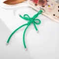 Detailweergave van een handgemaakte groene geweven nylon strikbedel voor telefoons - Slangenknoop Strik Stijl (K6104) / Groen