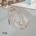 Detailed product parameters showing 14.9cm length and 26.8g weight for beaded phone strap - Butterfly Star Pendant (K6588) / Pink