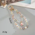 Close-up detail of double-layer beaded phone charm showing 15.3cm length and 25.3g weight. - Enamel Star Pendant (K6589) / Purple