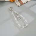 Close-up detail of iridescent beaded phone charm strap with silver butterfly pendant decoration - Gemstone Butterfly Tassel Charm (K6584) / Purple