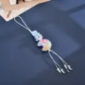 Close-up detail of the candy-colored moon and floral beaded camera strap - Embossed Moon Flower Accessory (K6556) / Blue