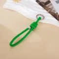 Detailed view of green braided leather keychain with Roman knot and silver bead - Green