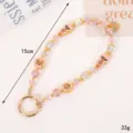 Handcrafted pink beaded phone wrist strap with crystal charms and gold metal ring - Gourd Clover Charm / 15cm/33g / Pink (K5721)