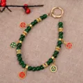 New Chinese style dark green beaded phone charm with elegant gold floral enameled pendants. - Five-Route Wealth God Pendant Charm / Dark Green (K5725)