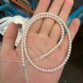 Detail view of 3.8-4mm round freshwater pearl semi-finished strand for jewelry making. - Length About 39cm Around 100 Pieces / Natural Pearl White