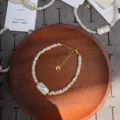 Detailed view of handmade baroque pearl bracelet with a unique rectangular focal pearl - Chewing Gum Baroque Style / 17+5cm / White