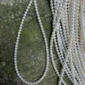 Close-up detail of natural freshwater pearl strands, 5-5.5mm near round loose beads for DIY. - One Strand / Length Approx 39cm Approx 76 Beads (Diameter 5-5.5mm) / Natural White