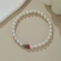 Natürliches Süßwasserperlenarmband mit bunten Zinnober- und Türkisperlen im Detail. - Naturperle Zinnober Exquisiter Stil (B4164)
