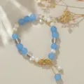 Detaillierte Nahaufnahme des retro chinesischen Süßwasserperlen und blauen Achat Armbands. - Aquamarin-Stil