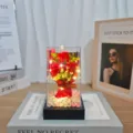 Artificial rose flower bouquet gift box with LED string lights and crystal stone base. - Red