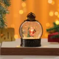 Close-up detail view of the Christmas water snow globe lantern with Santa Claus and glitter. - Santa Claus