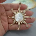 Gold-plated vintage sun pendant featuring a white mother of pearl center and sparkling cubic zirconia. - White Mother of Pearl Sun Pendant Only (Without Chain)