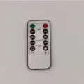 Replacement remote control for LED candles with timer and dimmer function, white plastic body. - 10-key Remote Control