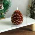 Bougie LED en forme de pomme de pin de Noël, finition marron et or, belle décoration. - Bougie pomme de pin marron à bords dorés en forme d'ogive
